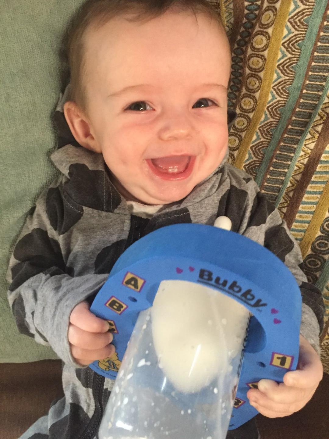 Baby Boy With Blue Baby Bottle Holder